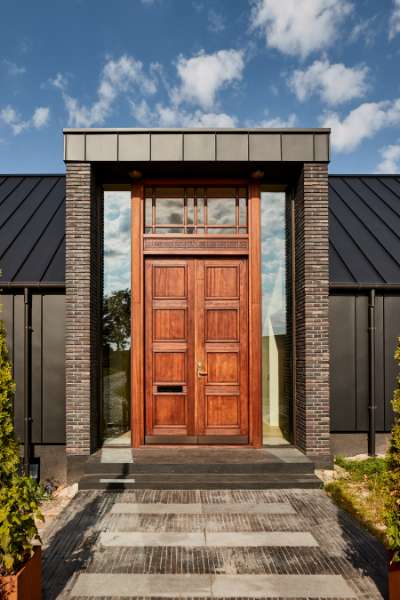 “Royal” door, found in Christiania, now installed in a steel façade, Volstrupvej 63, 9240 Nibe